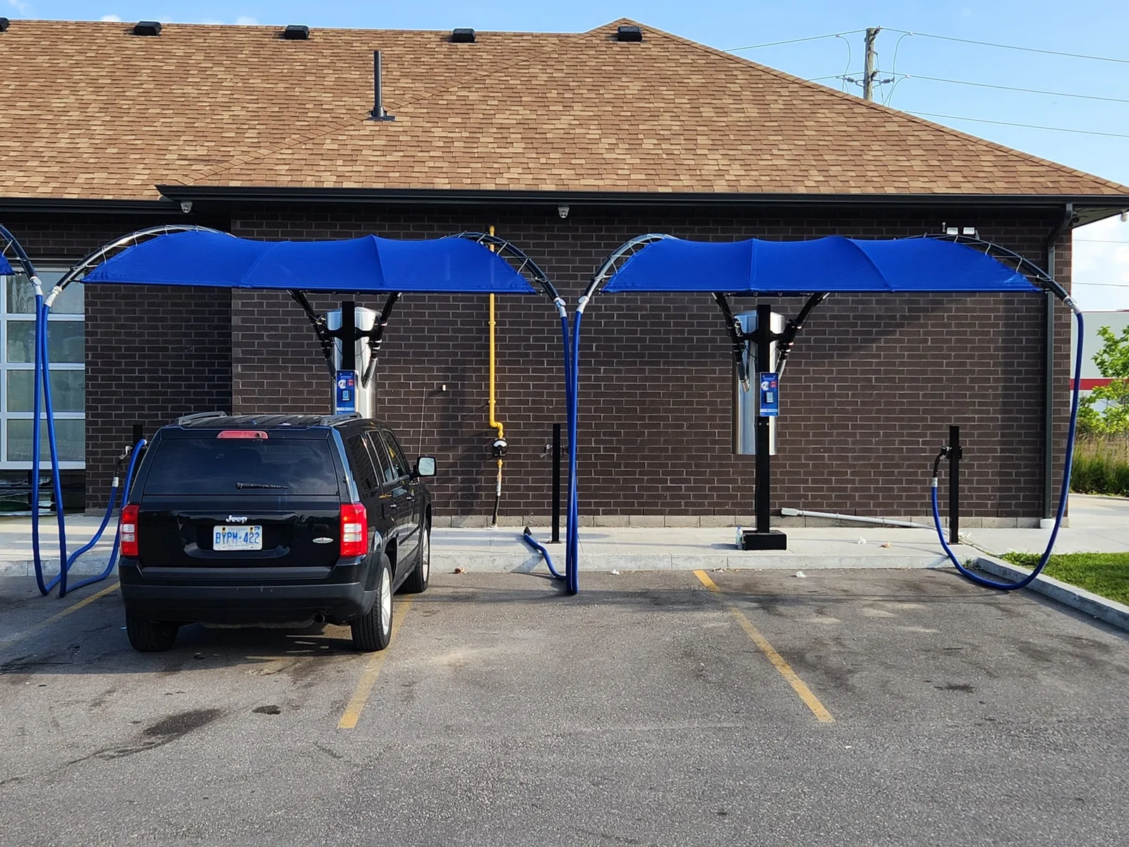 Eurovac vacuum hose drop at a car wash stall