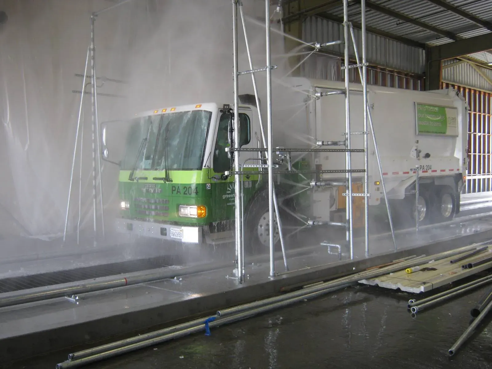 InterClean heavy-duty wash system cleaning a refuse truck