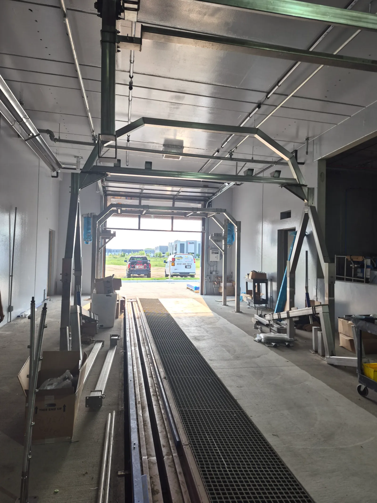 View down the tunnel conveyor toward the exit door