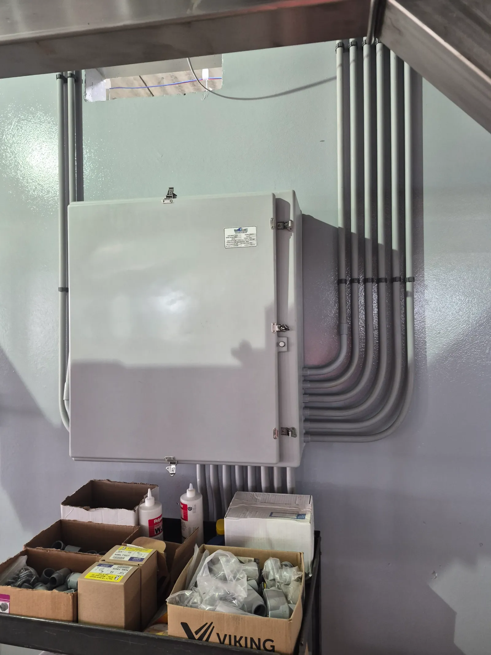 Electrical control panel with conduit runs