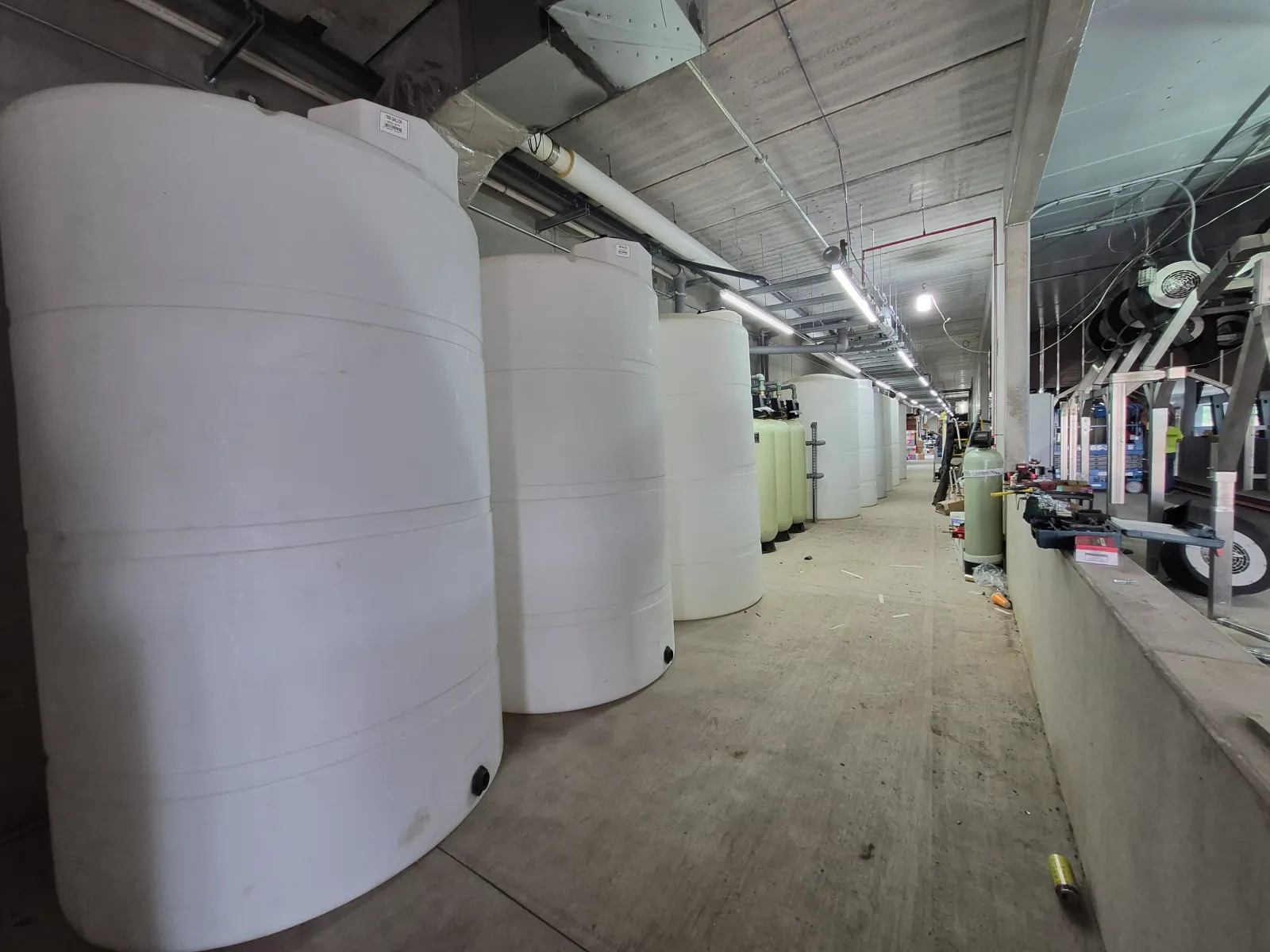 Large storage tanks along the tunnel wall